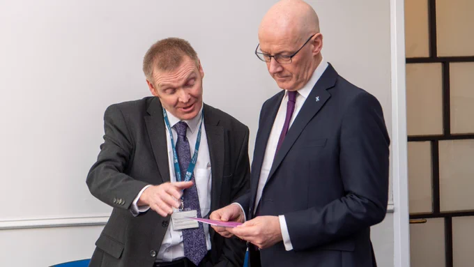 Neil Croll, Head of Widening Participation at the University of Glasgow with First Minister John Swinney. 