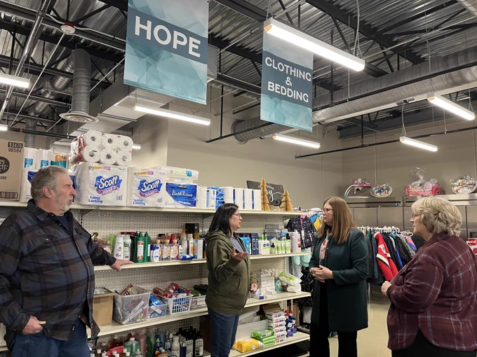 DOA Secretary Kathy Blumenfeld tours the food pantry at the Waupun Community Center with Terri Respalje, executive director of the Waupun Food Pantry and Community Table.