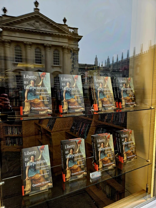 Window display for Liberty as Independence with the Senate House and part of Kings College Chapel reflected in the glass