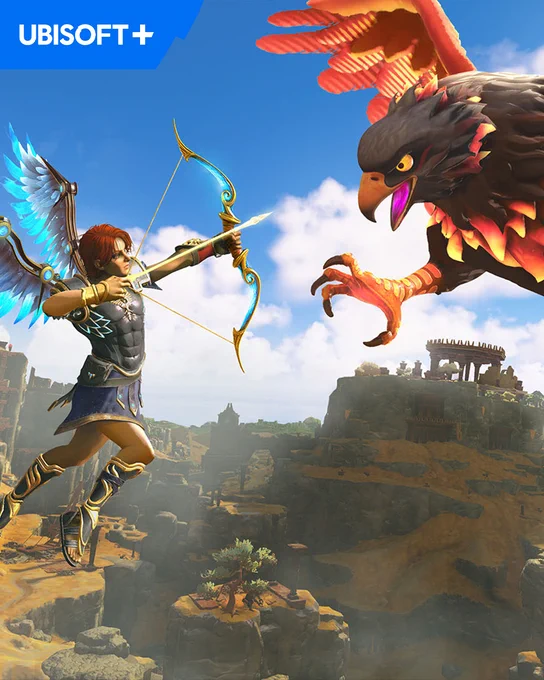 Picture taken from Immortals Fenyx Rising. Fenyx draws a golden bow, aiming a luminous arrow at a massive, fiery-feathered bird. The battle unfolds in mid-air over a rugged, ancient landscape with towering cliffs and crumbling ruins. A "UBISOFT " logo is displayed in the top left corner.