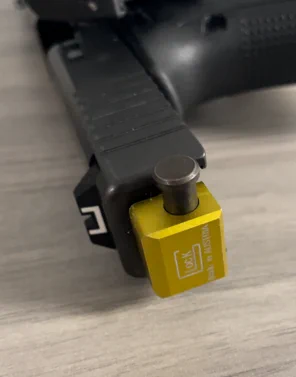 Firearm equipped with a machine gun conversion device. 
