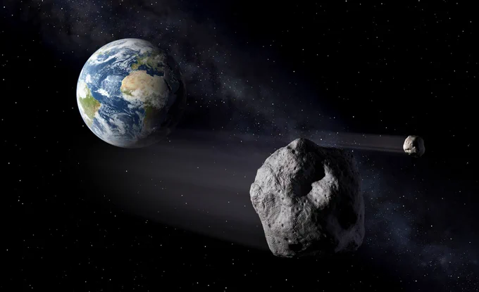An artist impression of two asteroids flying by Earth.