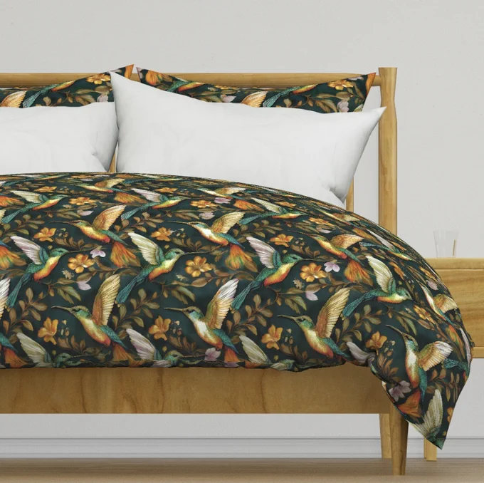 Vibrant hummingbirds with iridescent feathers flutter among golden flowers and lush foliage on a dark background. The repetitive pattern creates a lively and captivating design.