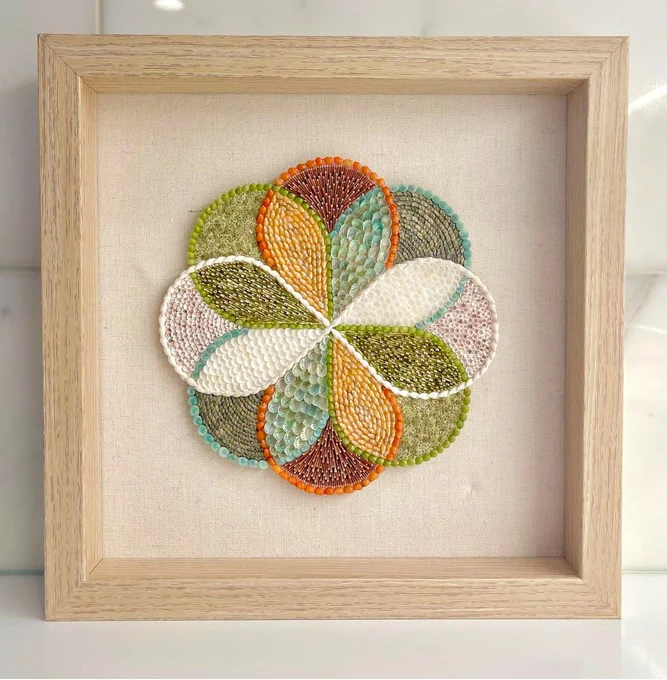 Infinity Check made out of seashells from around the world