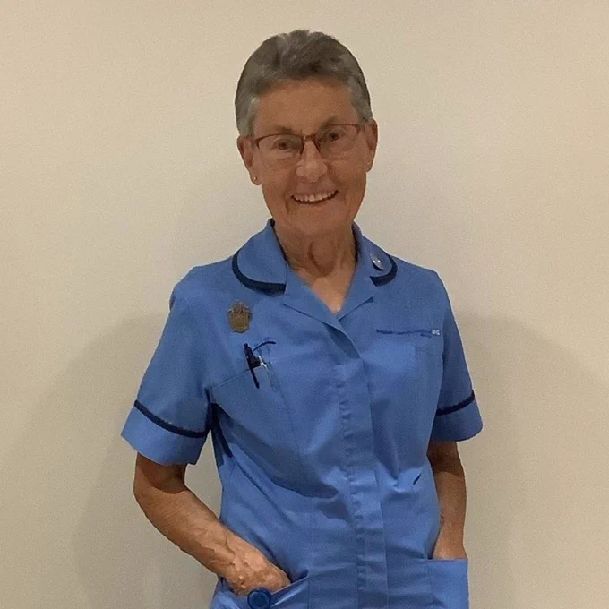 A photograph of Dianne now, in her current Nurse's uniform. 
