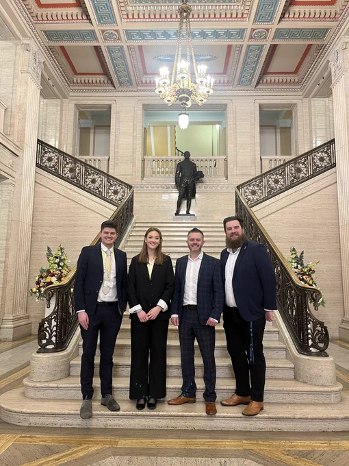 Robbie in the Great Hall at Stormont with reps from Home for Good and Safe Families