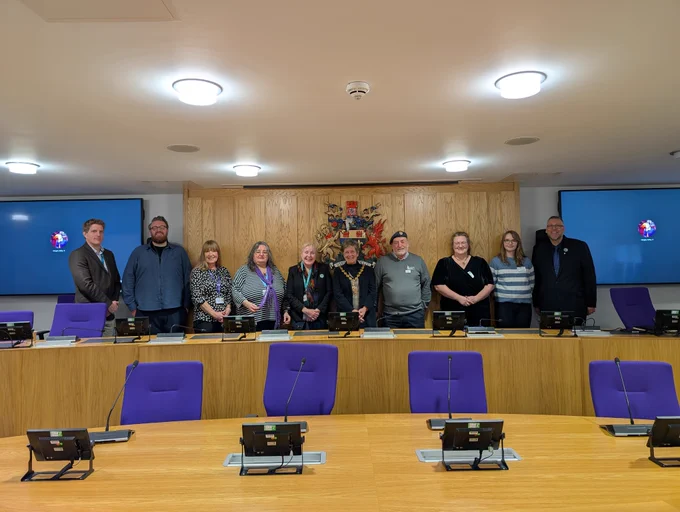 MCC and MHA officers with Cllr Angela Sandles, Cabinet Member for Equalities and Engagement, Alison Palmer, Deputy Director, GAVO, Cllr Mary Ann Brocklesby, Council Leader, Cllr Su McConnel, MCC Chair, Bryn Probert, Monmouthshire Veterans Support Hub Volunteer, Jenny Powell, The Gathering, Abergavenny & Morgan Collins, MonLife Youth Volunteer,