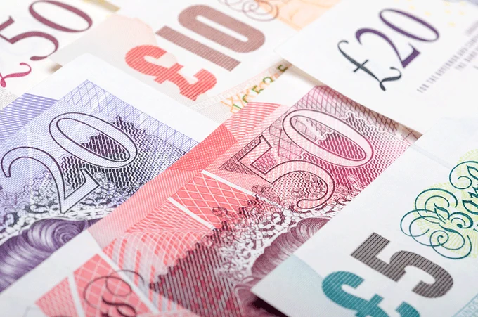Layered pound notes of different denominations