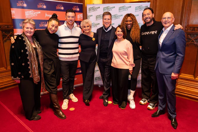 Alliance CEO Lisa Wainwright MBE, alongside Strictly Come Dancing's Nancy Xu, Kai Widdrington, Anton Du Beke, Montell Douglas, Craig Revel Horwood, and Angela Rippon CBE, Dame Arlene Phillips and Keith Bottomley.