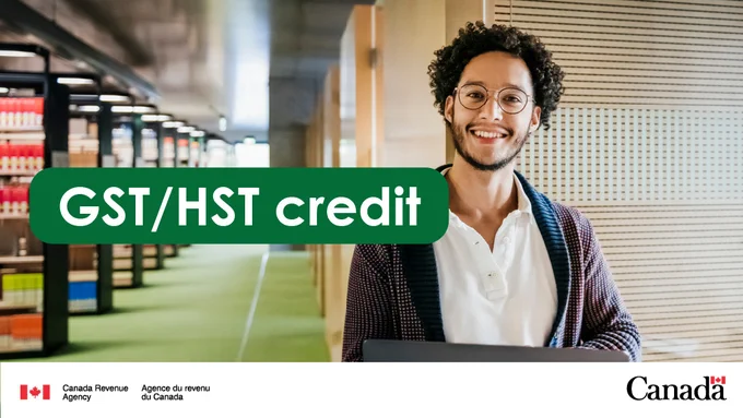 A smiling person in a library. “GST/HST credit”.