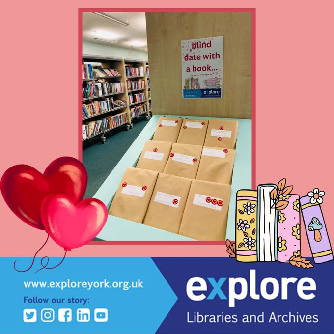 a book display of books wrapped up with heart stickers on them.