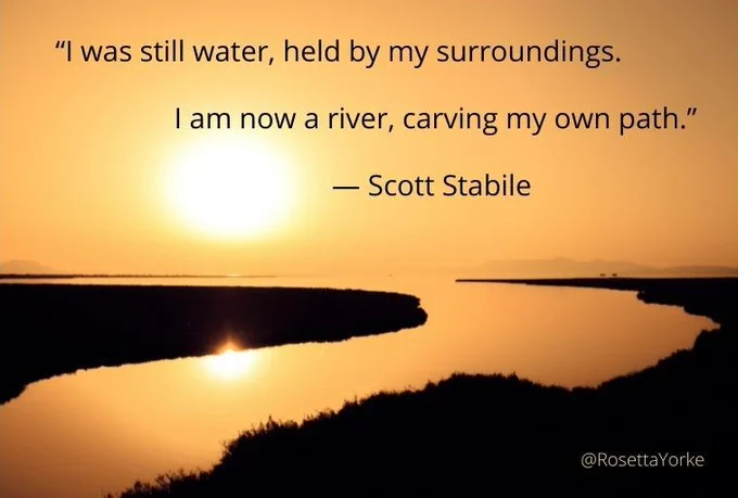 The text written over a golden sunset sky reflected in a river winding amongst silhouetted banks.