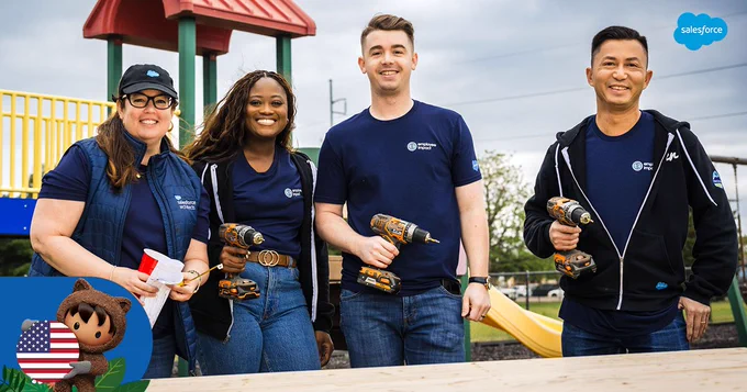 Three people hold screwdrivers while another holds screws, they stand in front of a playground and smile. Astro in the bottom left holds an American Flag in a circle.