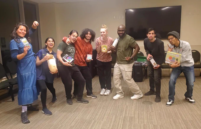 Graduate students participate in a hiphop dance workshop. 