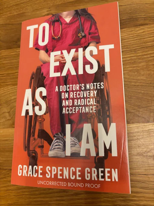 An orange book cover has an image of a wheelchair user in doctor’s scrubs.