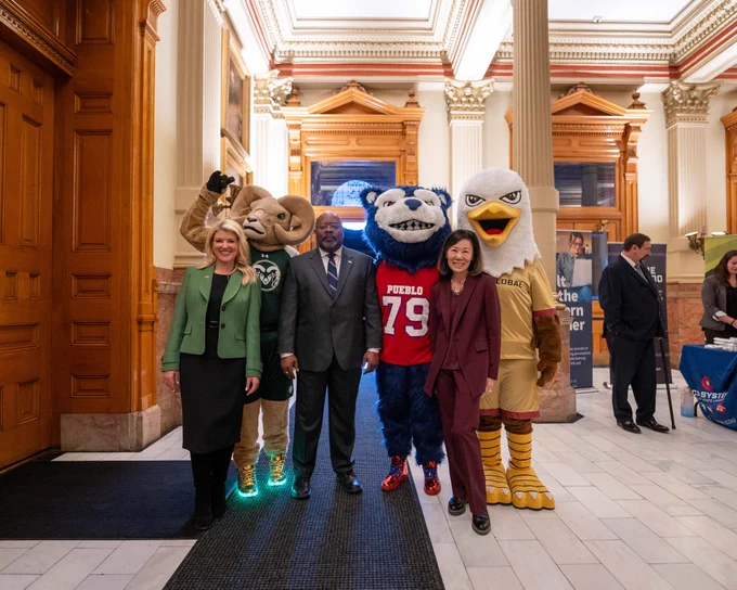 CAM the Ram posing for a picture with C S U President Parsons, C S U System Chancellor Frank, C S U Pueblo Interim President Munn, C S U Global President Takeda-Tinker, and mascots Wolfie and Goldie at the Colorado State Capitol on C S U Founders Day.