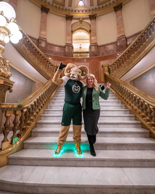 CAM the Ram posing for a picture with C S U President Parsons at the Colorado State Capitol on C S U Founders Day. 