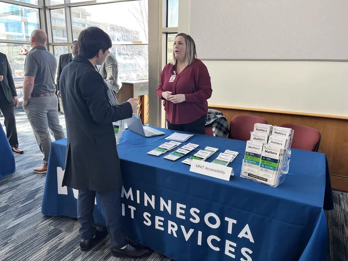 An IT vendor discusses procurement with a representative for Minnesota IT Services (MNIT) at the MNIT IT Vendor Fair.
