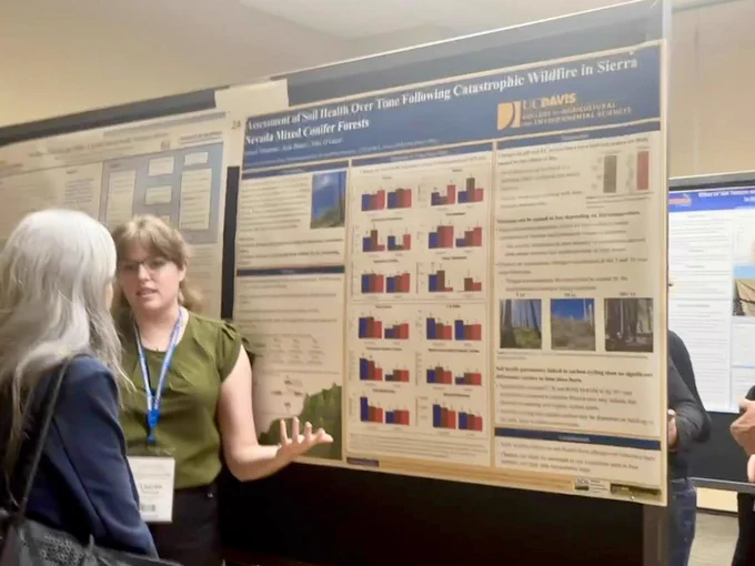 SBG student Lauren in action discussing her poster titled "Assessment of Soil Health Over Time Following Catastrophic Wildfire in Sierra Nevada Mixed Conifer Forests."