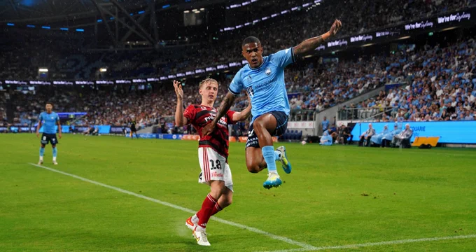Sydney FC’s Brazilian superstar Douglas Costa (blue jersey) in action against Western Sydney Wanderers’ Oscar Priestman at Allianz Stadium in Moore Park, Sydney on Saturday night, February 8, 2025. TWT On-the-Spot PHOTO (Michelle Haywood)
