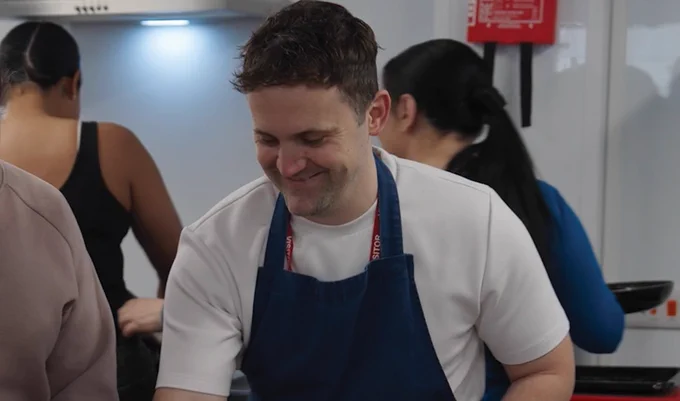 Jon Watts leading a cooking workshop with prisoners