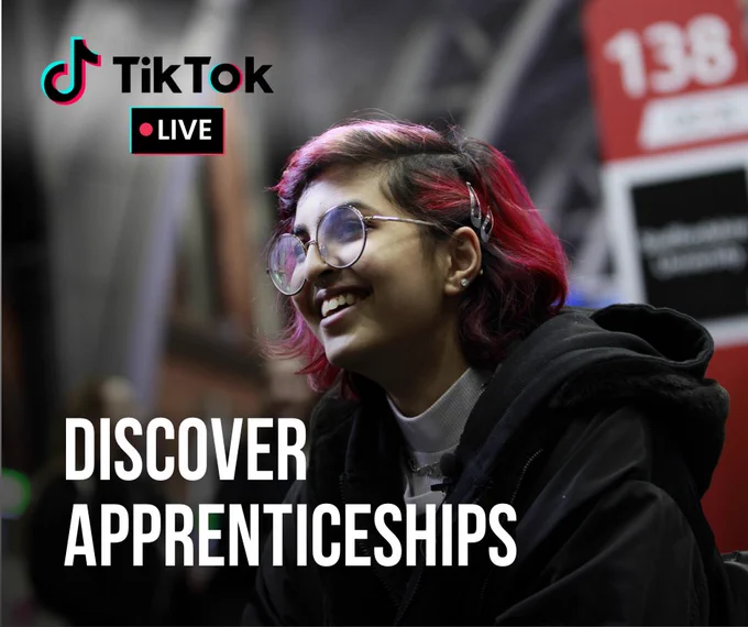 Person with red-tinted hair smiling and wearing glasses, seated in front of a 'TikTok LIVE' background that includes text reading 'DISCOVER APPRENTICESHIPS.'