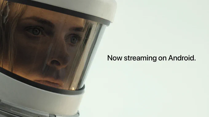From Silo. Juliette, portrayed by Rebecca Ferguson, looks serious with a helmet over her head. To the right of her, there is black text on-screen that reads "Now streaming on Android."