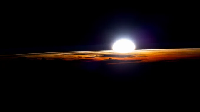 An orbital sunrise illuminates the cloud tops in this photograph from the International Space Station as it soared 262 miles above Namibia near the Atlantic coast. Credit: NASA