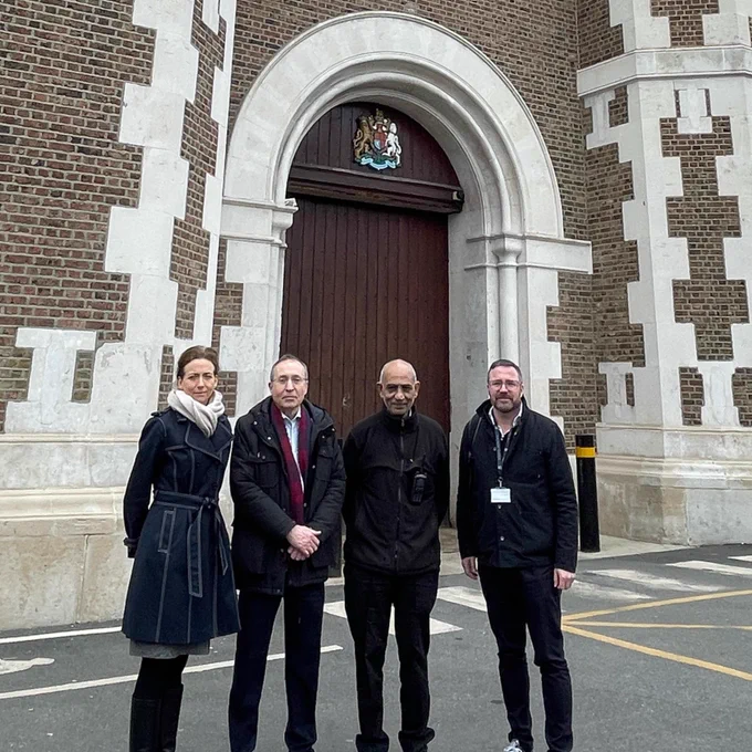 Photo showing Andy Slaughter MP, Pam Cox MP and staff from The Right Course standing outside the entrance to Wormwood Scrubs.