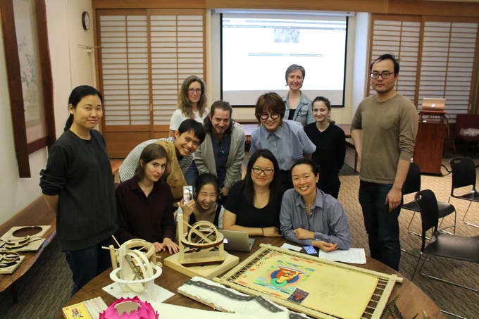 students showing their work in a classroom. 