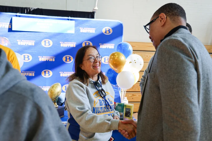 Chancellor Ferebee shakes hands with Principal Tukeva of Columbia Heights Education Campus.