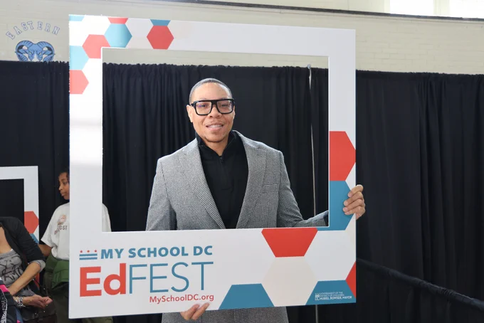 Chancellor Ferebee poses with an EdFEST frame prop.