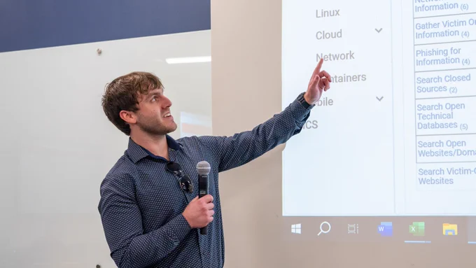 Man pointing to a presentation