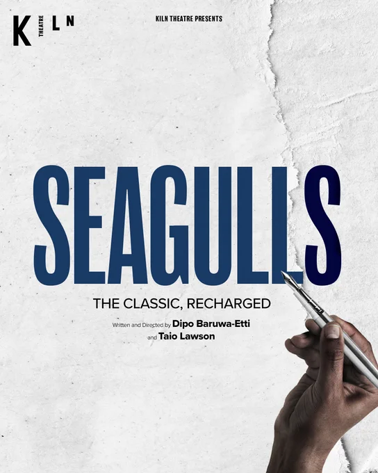 A black hand holding a pen over a ripped paper background, with the text ‘Kiln Theatre presents Seagulls, the classic, recharged, written and directed by Dip Baruwa-Etti and Taio Lawson’