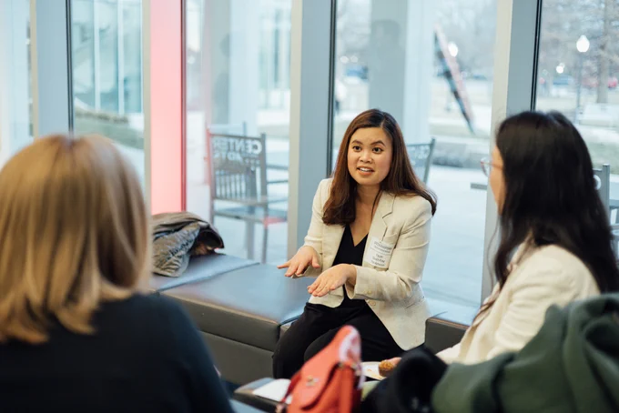 Pitchayaporn Tantihkarnchana from economics chats with new friends.