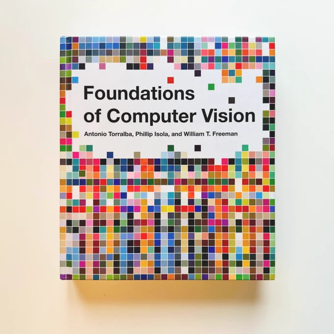 A book titled "Foundations of Computer Vision" by Antonio Torralba, Phillip Isola, and William T. Freeman, featuring a colorful pixelated design on the cover.