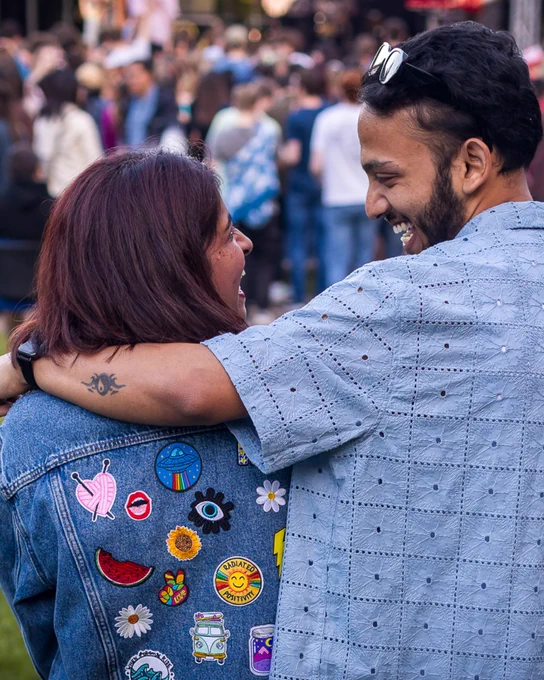 Image of a couple smiling at one another at Valefest.
