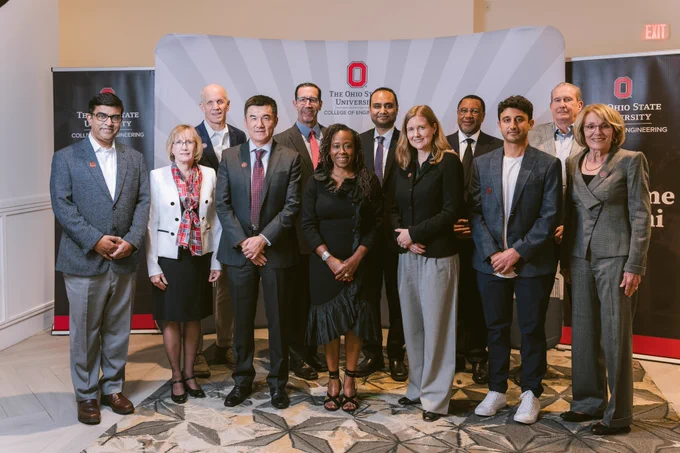 Group of individuals posing for a photograph at The Ohio State University event.