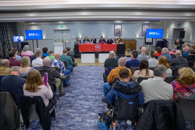 A picture taken from the back of the room showing the full conference 
