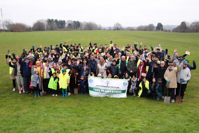 An image of all of the volunteers cheering at Churchfields Playing Fields. 