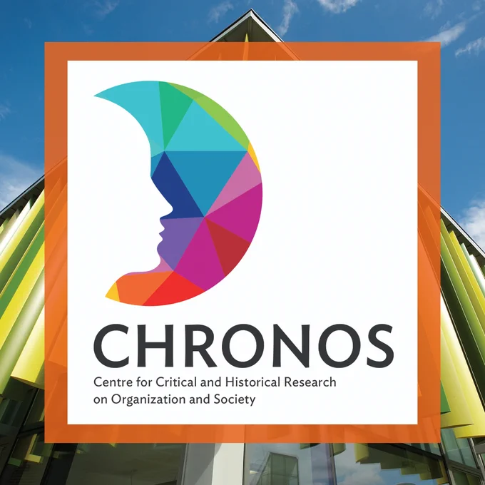 Photograph of the Business School building with the logo for CHRONOS on top - a multicoloured circle with the silhouette of a head cut out from it and the title of the research centre beneath 