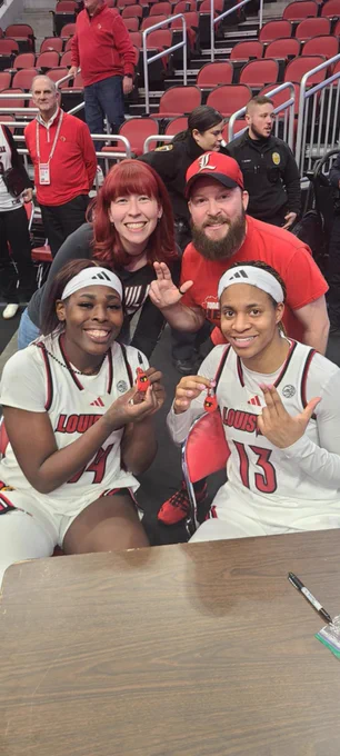 Charlotte, Patrick, Olivia and Merissah pose with cardinal keychains.