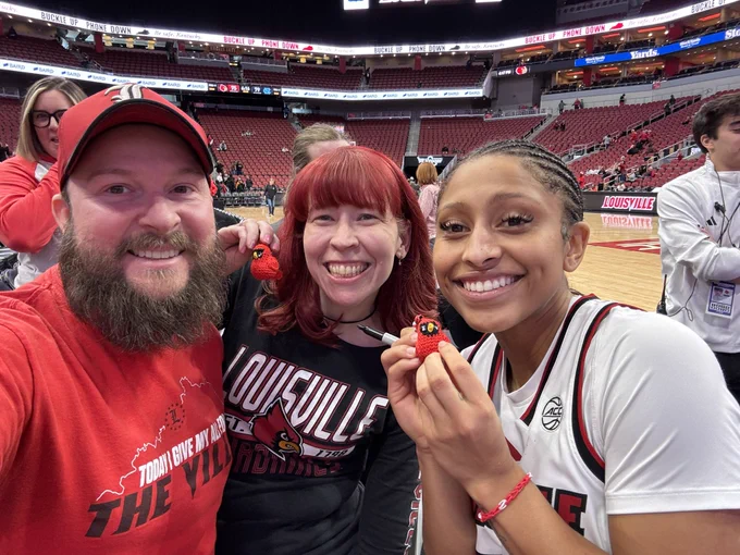 Patrick, Charlotte and Jayda pose with a cardinal.
