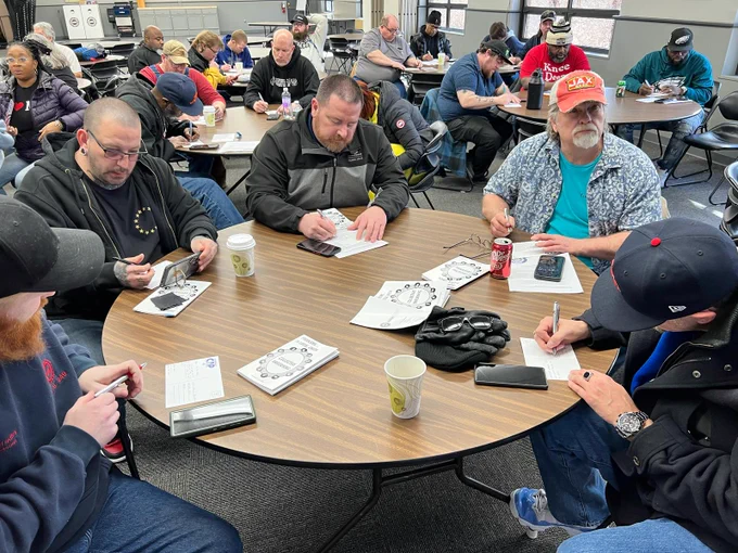 UAW Region 4 members at the Pat Greathouse Education Center preparing to call key Senators and Congresspeople to demand "No Cuts to NIH Funding."
