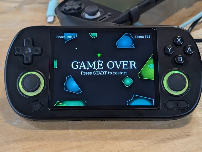 an RG40XX device running a javascript game