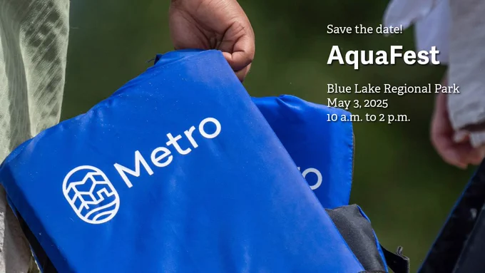 Close-up of a person holding blue Metro-branded life jackets. Text promotes AquaFest at Blue Lake Regional Park on May 3 from 10 a.m. to 2 p.m.