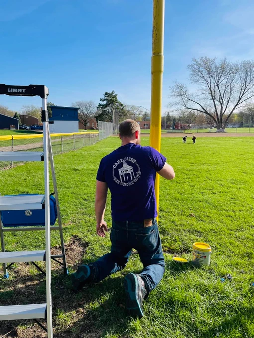 Candidate Scott for Village of Cary, Illinois, Mayor (voting March 17th - April 1st) with his family, painting foul poles at a baseball field located at Maplewood, a park recently purchased by the Village of Cary.