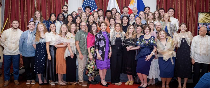 Ambassador MaryKay Carlson and Peace Corps Philippines Country Director Marguerite Roy with Peace Corps volunteers.