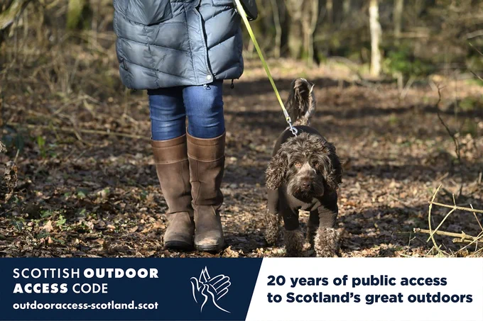 Photo of a dog being walked on a short lead. Text on image: Scottish Outdoor Access Code. 20 years of public access to Scotland's great outdoors