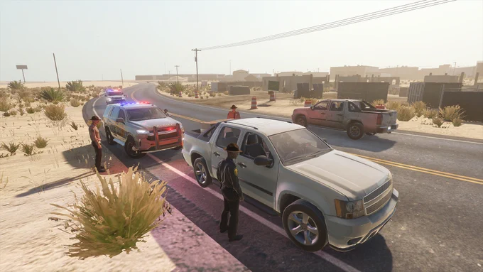 A screenshot from Flashing Lights, showing a civilian car pulled over by a police car, with three police officers surrounding the vehicle. This is taking place on a road through the desert, with some shipping containers in the background.